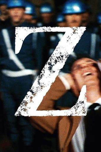 The poster features a gritty, industrial scene with workers in blue hard hats, their faces contorted in distress. A large, distressed "Z" dominates the foreground, symbolizing the film's themes of industrial conflict and human suffering. The muted tones and somber expressions evoke a sense of mel...