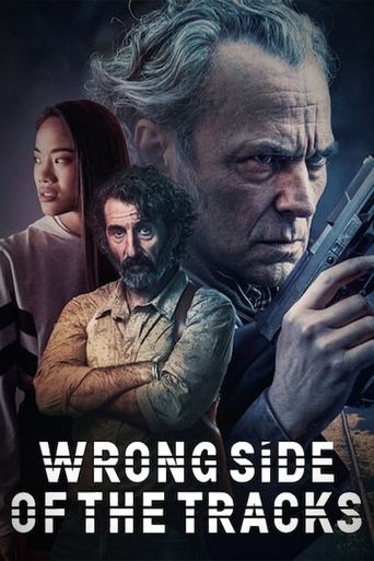 The poster features three characters against a dark, moody background. A rugged man in the foreground holds a gun, exuding intensity. A woman with long hair gazes forward, while another man stands behind her. The color palette is dark with muted tones, creating a suspenseful atmosphere. The title...