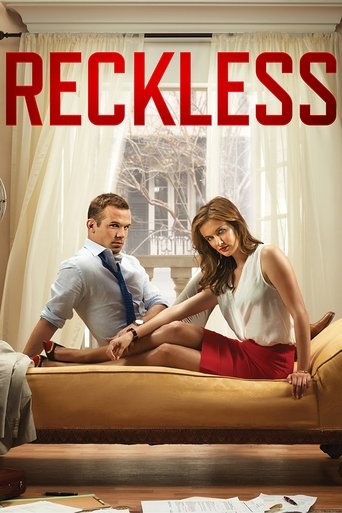 The poster features a man in a light blue shirt and tie sitting on a beige couch, while a woman in a white top and red skirt leans forward, looking at him with a playful expression. The warm, cozy lighting and soft curtains create a relaxed, everyday atmosphere, hinting at the comedic and everyda...