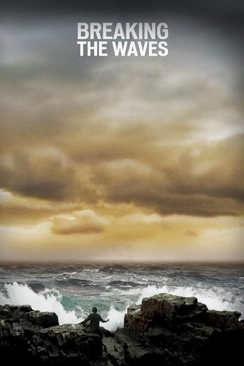 The poster depicts a dramatic stormy scene with dark, jagged rocks in the foreground and turbulent waves crashing against them. Above, ominous clouds fill the sky, casting a somber and intense mood over the ocean. The title "Breaking the Waves" is prominently displayed at the top in bold white text.