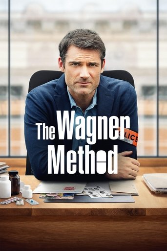 The poster features a man in a dark blue sweater sitting at a cluttered desk with various items like pens and papers. The title "The Wagner Method" is prominently displayed in bold white letters. The background shows a blurred office window with warm lighting, creating a professional yet relaxed ...
