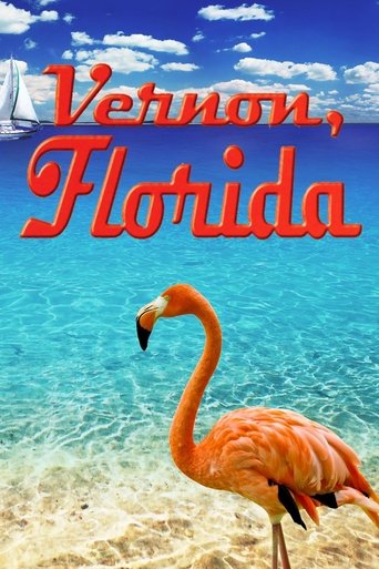 This vibrant movie poster captures the essence of a tropical vacation with a flamingo as the focal point against a backdrop of clear blue skies and turquoise waters. The bold red text "Vernon, Florida" stands out against the scenic landscape, evoking a sense of adventure and relaxation.
