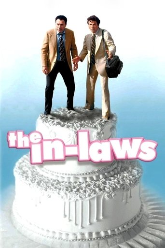 The poster features two men in business suits standing atop a giant cake, with the title "The In-Laws" prominently displayed in pink. The cake is decorated with intricate designs, and the background is a soft gradient of blue and white. The overall mood suggests a blend of humor and romance, with...