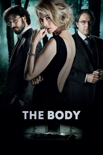 The poster features three men and a woman in a moody, dark forest setting. The woman in the center wears a black dress with a plunging back, while the men around her are dressed in suits. The color palette is dominated by dark greens, blacks, and cool tones, creating an eerie and suspenseful atmo...