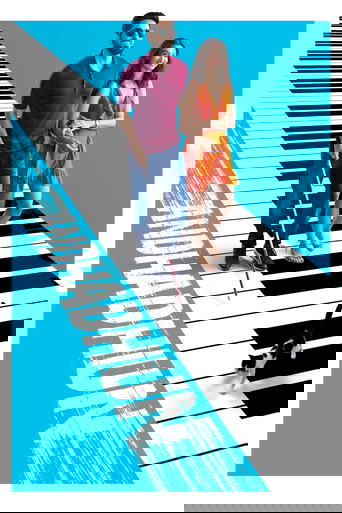 The poster features a man and woman standing on a stylized keyboard, with the title "Andhadhun" prominently displayed in bold, white letters against a vibrant blue background. The image conveys a playful yet mysterious mood, suggesting themes of mystery and intrigue.