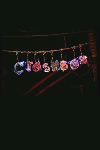 A vibrant "Crashbox" poster captures the chaotic energy of a late-night comedy show. The letters are illuminated in colorful, dynamic hues against a dark background, evoking excitement and fun. The poster suggests a lively, entertaining experience for viewers.