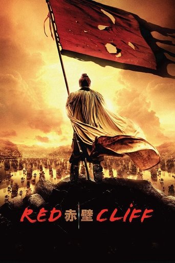 The poster features a lone figure with flowing hair standing atop a hill, facing a massive red flag with a skull emblem. The background depicts a desolate battlefield with scattered soldiers and ruins, bathed in warm, ominous orange and yellow hues. The title "Red Cliff" appears in bold red text ...