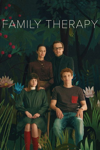 The poster features a group of four people in a lush, dark forest setting, surrounded by vibrant flowers and foliage. The mood is serene yet mysterious, with a blend of natural beauty and emotional depth. The title "Family Therapy" is prominently displayed at the top, suggesting a story about und...