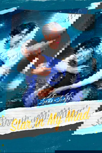 The poster features two young men in a romantic pose against a starry night sky, with a full moon visible in the background. The cool blue tones of the night sky contrast with the warm tones of their clothing and the golden text at the bottom. The mood is romantic and dreamy, capturing a moment o...