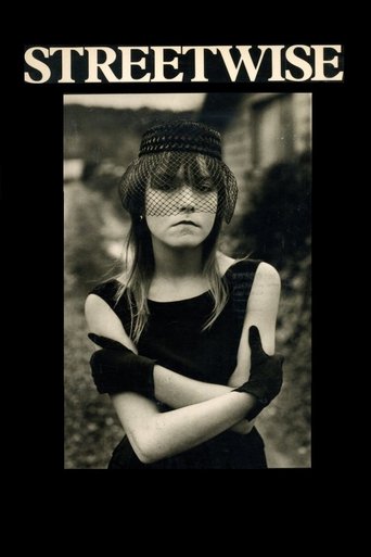 The poster features a striking black-and-white portrait of a woman with her arms crossed, exuding a rebellious and edgy vibe. The bold, capitalized "STREETWISE" text at the top reinforces the film's gritty and urban theme.