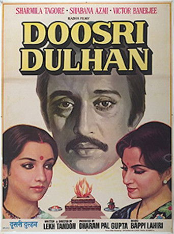 The poster features a dramatic portrait of a man with a mustache, flanked by two women with traditional makeup. The title "DOOSRI DULHAN" is prominently displayed in bold, golden letters. The overall mood is intense and cinematic, with rich colors and a sense of drama.