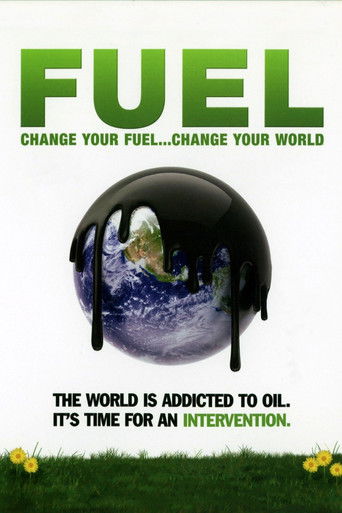 The poster features a glossy black oil can with a reflective globe inside, symbolizing environmental pollution. The bold green text "FUEL" dominates the top, emphasizing the urgency of the message. The scene conveys a somber mood, with the dark oil can and reflective globe suggesting a harsh real...