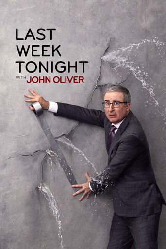 The poster features a man in a suit breaking through a cracked wall, symbolizing the show's satirical approach. The dark tones and cracked textures create a dramatic, humorous atmosphere.