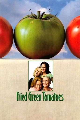 The poster features a green tomato in the center, flanked by red tomatoes against a blue sky. Below, three people smile warmly, suggesting a family-friendly comedy. The title "Fried Green Tomatoes" is prominently displayed in green text, evoking a fresh, appetizing, and cheerful mood.
