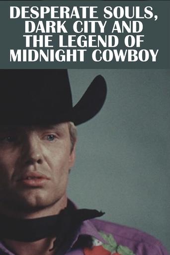 The poster features a close-up of a man in a black cowboy hat, wearing a purple shirt with a floral pattern. The dark, moody background evokes a sense of mystery and drama. The bold white text at the top hints at a gritty, noir-style film.