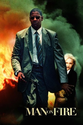 The poster features a man in a suit walking through a fiery, smoky landscape, with a woman in the background. The intense colors of orange, green, and dark tones evoke a sense of danger and urgency, capturing the film's gritty and dramatic atmosphere.