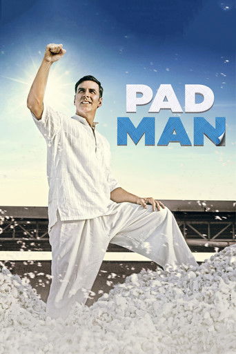 The poster features a muscular man in white martial arts attire, striking a powerful pose with one arm raised. The background showcases a serene ocean scene with gentle waves and a clear blue sky, evoking a sense of calm and strength. The title "PAD MAN" is prominently displayed in bold, eye-catc...