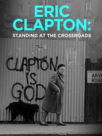 The poster features Eric Clapton in a contemplative pose against a backdrop of graffiti, evoking a sense of introspection and artistic struggle. The muted tones and shadowy elements suggest a serious and reflective mood, highlighting Clapton's enduring legacy and the themes of his musical journey.