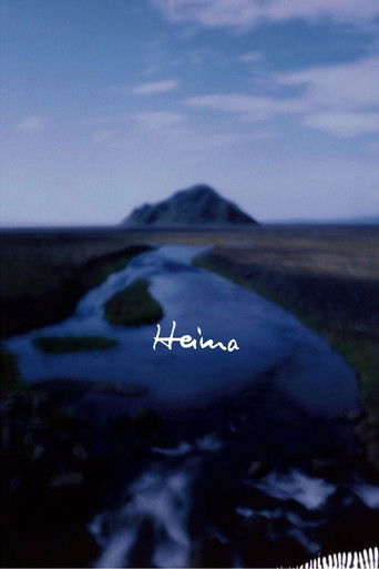 The poster features a serene landscape with a winding river and distant mountains under a twilight sky. The word "Heima" is elegantly written in white script, suggesting a tranquil and mysterious atmosphere.
