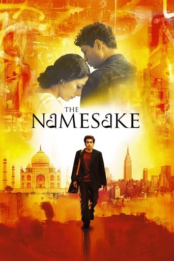 The poster features a dramatic scene with a man and woman in the foreground, set against a fiery, warm-toned backdrop. The title "The Namesake" is prominently displayed in bold, white lettering. The overall mood is intense and emotional, suggesting themes of love, loss, and identity.