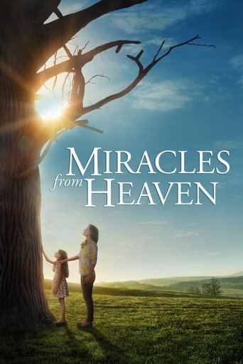 The poster features a tender scene of a man and a child standing under a large tree, bathed in warm golden sunlight. The colors are vibrant, with deep blues and greens of the sky and grass, creating a peaceful and hopeful atmosphere. The title, "Miracles from Heaven," is elegantly displayed in wh...