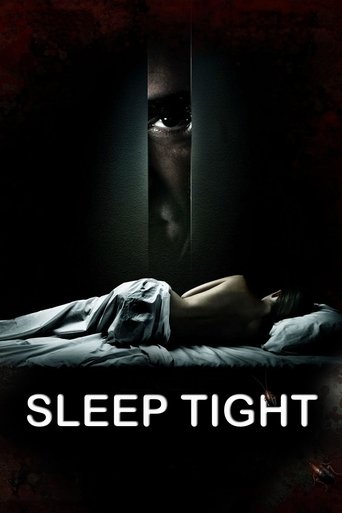The poster features a dark, ominous scene with a person lying on a bed, their face partially obscured by shadows. Above, a menacing figure peeks through a vertical slit, creating a sense of suspense and danger. The color palette is dominated by deep blacks and grays, with a hint of red, enhancing...