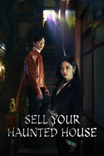 The poster features two characters in a dimly lit, eerie house interior. The warm glow from above contrasts with the cool tones of the room, creating a suspenseful and mysterious atmosphere. The title "Sell Your Haunted House" is prominently displayed in bold, white letters at the bottom.