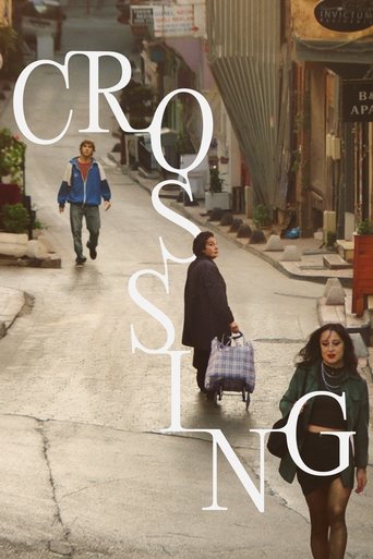 The poster features a gritty urban street scene with people walking, carrying luggage, and carrying shopping bags. The muted colors of gray, brown, and muted greens evoke a somber, reflective mood. The word "CROSSING" is prominently displayed in large, white, semi-transparent letters, blending se...