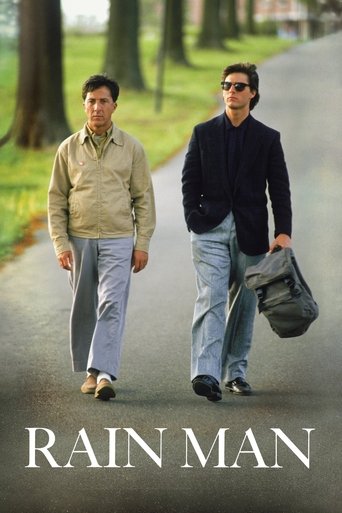 Two men walk down a tree-lined path, carrying a bag. The warm beige and blue tones evoke a nostalgic, reflective mood. The poster suggests a story of friendship and loss.