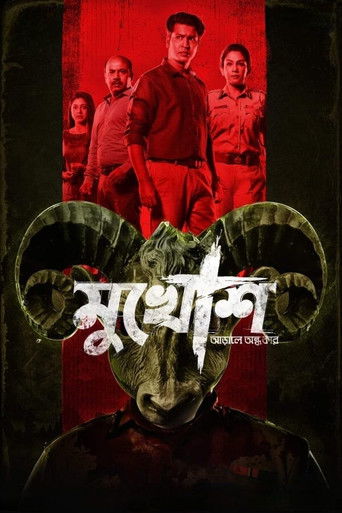 The poster features a dark, ominous scene with a menacing figure in the foreground, surrounded by four soldiers in red uniforms against a red backdrop. The title "Mukhosh" is prominently displayed in bold, stylized text, evoking a sense of danger and intrigue. The overall mood is tense and suspen...