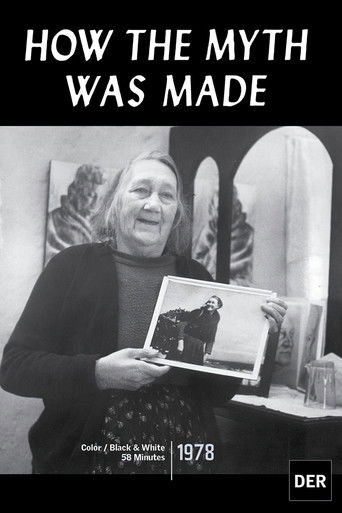 The poster features a black-and-white photograph of a smiling woman holding a framed image of a man in rugged attire, set against a backdrop of arched windows. The title "HOW THE MYTH WAS MADE" is prominently displayed at the top in bold, white letters. The overall mood is nostalgic and reflectiv...