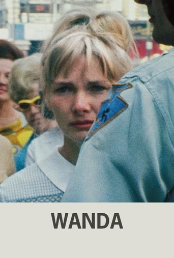The poster features a young woman with blonde hair, wearing a light blue shirt, surrounded by other people in a bustling outdoor setting. The mood is intense and dramatic, capturing the essence of the film's action-packed narrative.