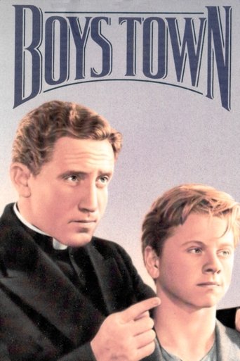 The poster features two men in a somber, contemplative mood. The older man, dressed in a black robe, gazes thoughtfully to the side, while the younger man, wearing a light-colored shirt, looks forward with a serious expression. The title "BOYS TOWN" is prominently displayed at the top in bold, da...