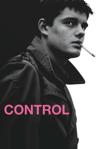 The poster features a moody, black-and-white portrait of a man smoking against a stark white background. The bold pink text "CONTROL" anchors the composition, evoking themes of power and control. The overall atmosphere is intense and dramatic.