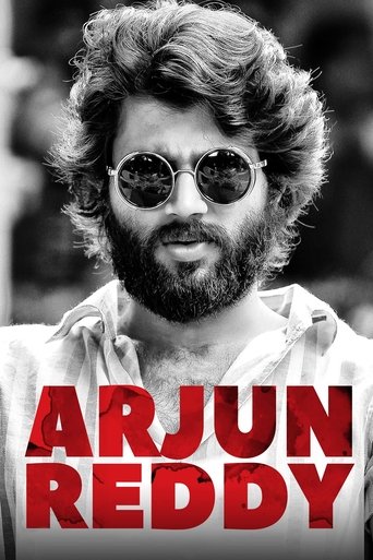 This black-and-white poster features a rugged, bearded man with curly hair and sunglasses, exuding a rebellious and confident vibe. Bold red text overlays the image, emphasizing the name "Arjun Reddy" in a striking, bold font. The overall mood is energetic and timeless, capturing the essence of t...