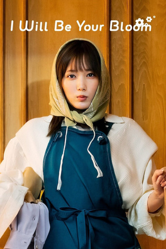 The poster features a young woman with a serene expression, wearing a white cardigan over a teal dress with a yellow headscarf. The warm wooden background and soft lighting create a cozy, intimate atmosphere. The title "I Will Be Your Bloom" is elegantly placed at the top, suggesting themes of be...