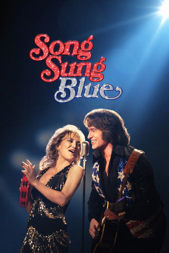This movie poster features a glamorous couple in a romantic embrace against a dark, starlit background. The title "Song Sung Blue" is elegantly displayed in red and blue script. The mood is romantic and dreamy, capturing the essence of a classic musical film.