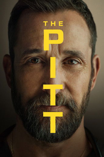 The poster features a close-up of a man with a beard, his eyes wide and intense. Bold yellow letters spell "THE PITT" vertically across his face. The dark background contrasts sharply with the bright yellow text, creating a dramatic and mysterious mood.