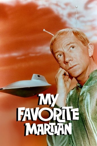 The poster features a man with a thoughtful expression against a vibrant orange sky, with a classic UFO hovering in the foreground. The bold white text "My Favorite Martian" stands out prominently, evoking a sense of nostalgia and wonder.