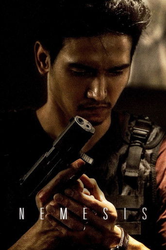 The poster features a determined man with dark hair and intense eyes, holding a pistol in a dramatic pose. The dark, moody lighting enhances the gritty atmosphere, while the title "NEMESIS" is prominently displayed in bold, metallic letters.