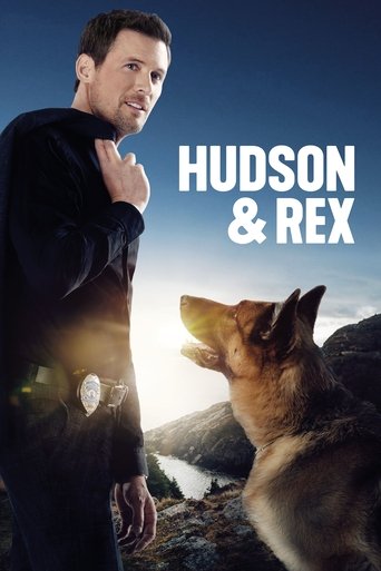 The poster features a man in a dark jacket and a wolf howling in the background, set against a dramatic sky. The warm sunlight creates a glowing effect, while the bold text "HUDSON & REX" stands out prominently. The mood is intense and adventurous, capturing the essence of the show's thrilling na...