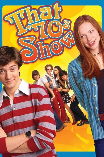 The poster features a vibrant yellow background with bold, colorful text. Two main characters stand prominently: a man in a striped shirt on the left and a woman in a blue cardigan on the right. Behind them, other characters are visible, adding depth to the scene. The overall mood is cheerful and...