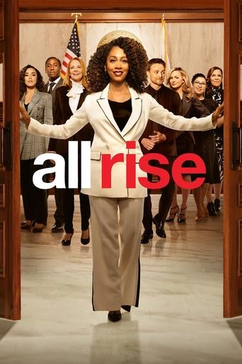The poster features a powerful woman in a white suit leading a diverse group of people in a hallway, symbolizing unity and hope. The bold red text "all rise" stands out against the neutral tones, conveying a sense of empowerment and forward momentum.