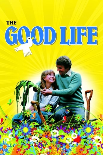 The Good Life poster features a joyful couple sitting amidst a vibrant field of colorful flowers, radiating happiness and warmth. The bright yellow background with sunburst rays enhances the cheerful and uplifting mood, emphasizing themes of life's beauty and contentment.