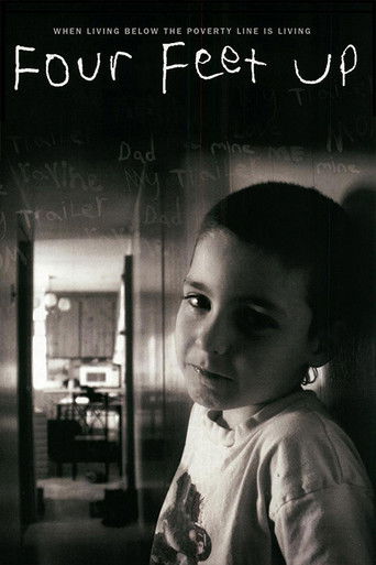 The poster features a young boy with a contemplative expression, his face partially illuminated against a dark background. The title "Four Feet Up" is prominently displayed in bold, white text at the top. The overall mood is mysterious and slightly melancholic, with muted tones and a sense of qui...