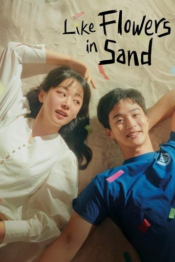 The poster features a young couple lying on a sandy beach, exuding a carefree and romantic mood. The warm tones of the sand and the soft lighting evoke a sense of nostalgia and happiness.