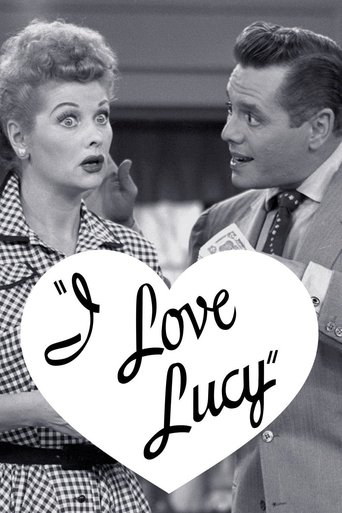 This TV show poster features iconic black-and-white portraits of Lucille Ball and Dean Martin, capturing their classic comedic chemistry. The heart-shaped overlay with the title "I Love Lucy" adds a nostalgic touch, while the checkered dress and formal attire evoke a timeless, glamorous era.