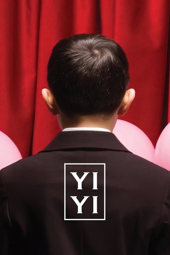 The poster features a man from behind, wearing a black suit with "YI YI" in white letters on his back. He stands before a vibrant red curtain, creating a dramatic and mysterious atmosphere. The image evokes intrigue and suspense, suggesting a thrilling narrative waiting to unfold.