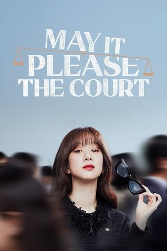 The poster features a woman with dark hair and red lipstick holding a microphone, standing against a blurred background of other people. The title "MAY IT PLEASE THE COURT" is prominently displayed in white text at the top. The overall mood is dramatic and mysterious, with a focus on the central ...