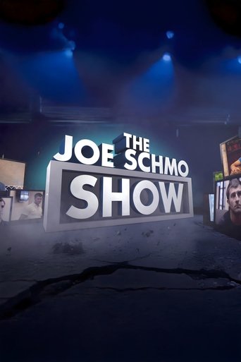 The Joe Schmo Show poster features a dimly lit stage with a large, illuminated sign displaying the show's title. The dark background and spotlight create an eerie, mysterious atmosphere, while the bright white text contrasts sharply against the shadowy surroundings.